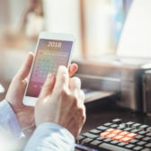 Businessman checks calendar on his smartphone application