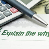 Explain the whys printed on book with calculator and pen