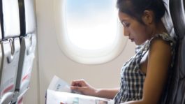 woman-reading-on-airplane.jpeg