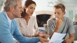 parents-review-paperwork-with-teenage-son_iStock-482556505.webp