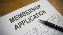 Blank membership application on desk with ballpoint pen