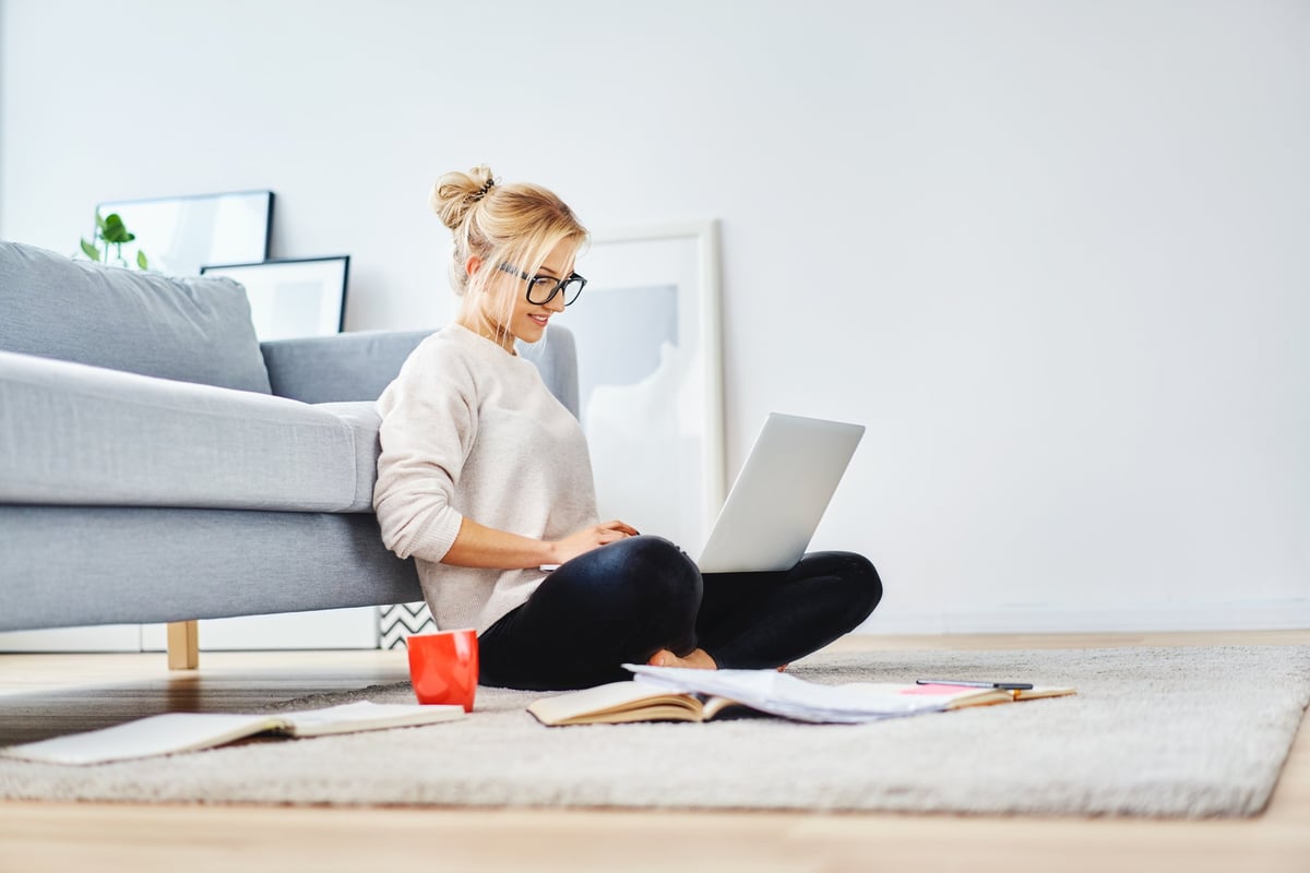 Young_woman_on_laptop_on_floor_luhLhrm-1.jpeg