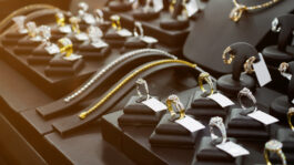 gold-jewelry-diamond-shop-with-rings-necklaces-luxury-retail-store-window-display-showcase.jpeg