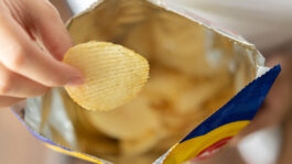 hand-hold-potato-chips-snack-61598070.jpeg