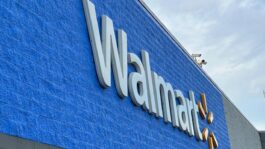 A_Walmart_sign_on_a_blue_brick_building.jpeg