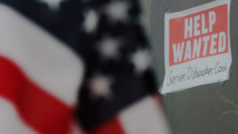 FILE PHOTO: A “Help Wanted” sign hangs in restaurant window in Medford
