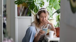 Young_woman_listening_to_pod.2e16d0ba.fill-1200x675-c100