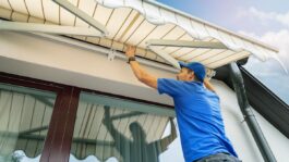man-assembling-awning-house.jpeg