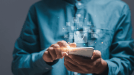 How AI agents are changing the grocery basket A_shopper_uses_his_smartphone_to_grocery_shop